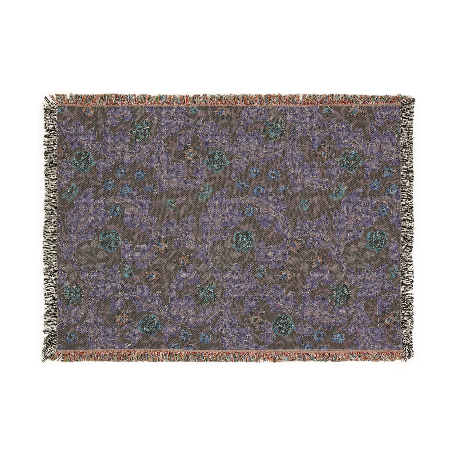 Patterned throw blanket with fringe on a white background