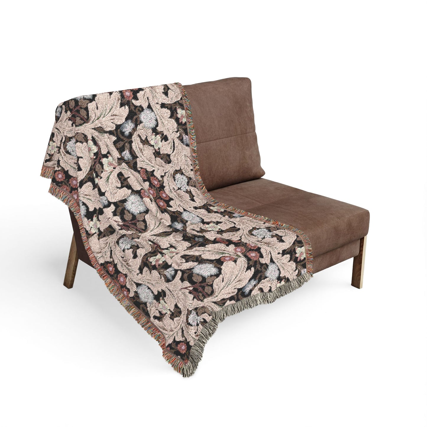 Brown patterned throw blanket draped over a brown chair on a white background