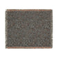 Patterned throw blanket with fringes on a white background