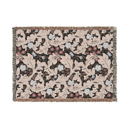 Decorative woven blanket with floral pattern on a white background