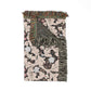 Decorative throw blanket with floral pattern and fringe on a white background