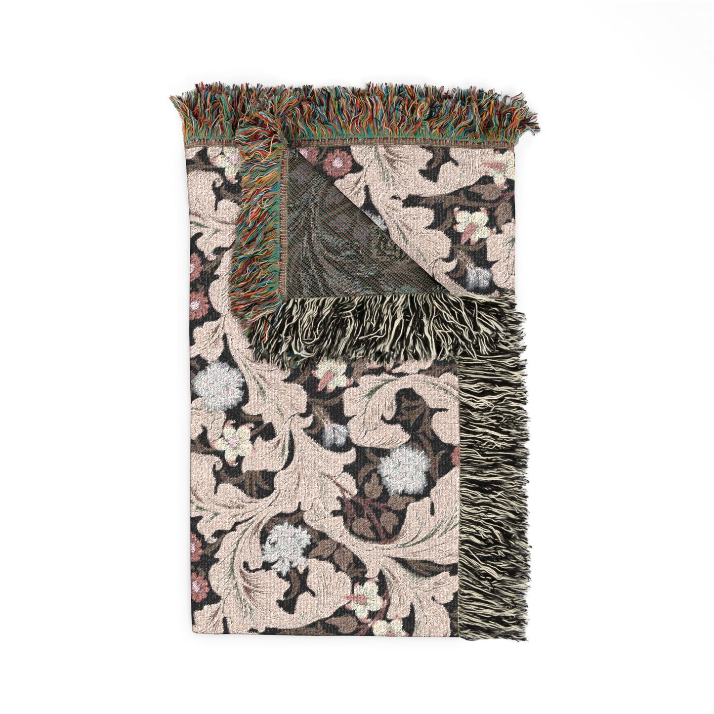 Decorative throw blanket with floral pattern and fringe on a white background