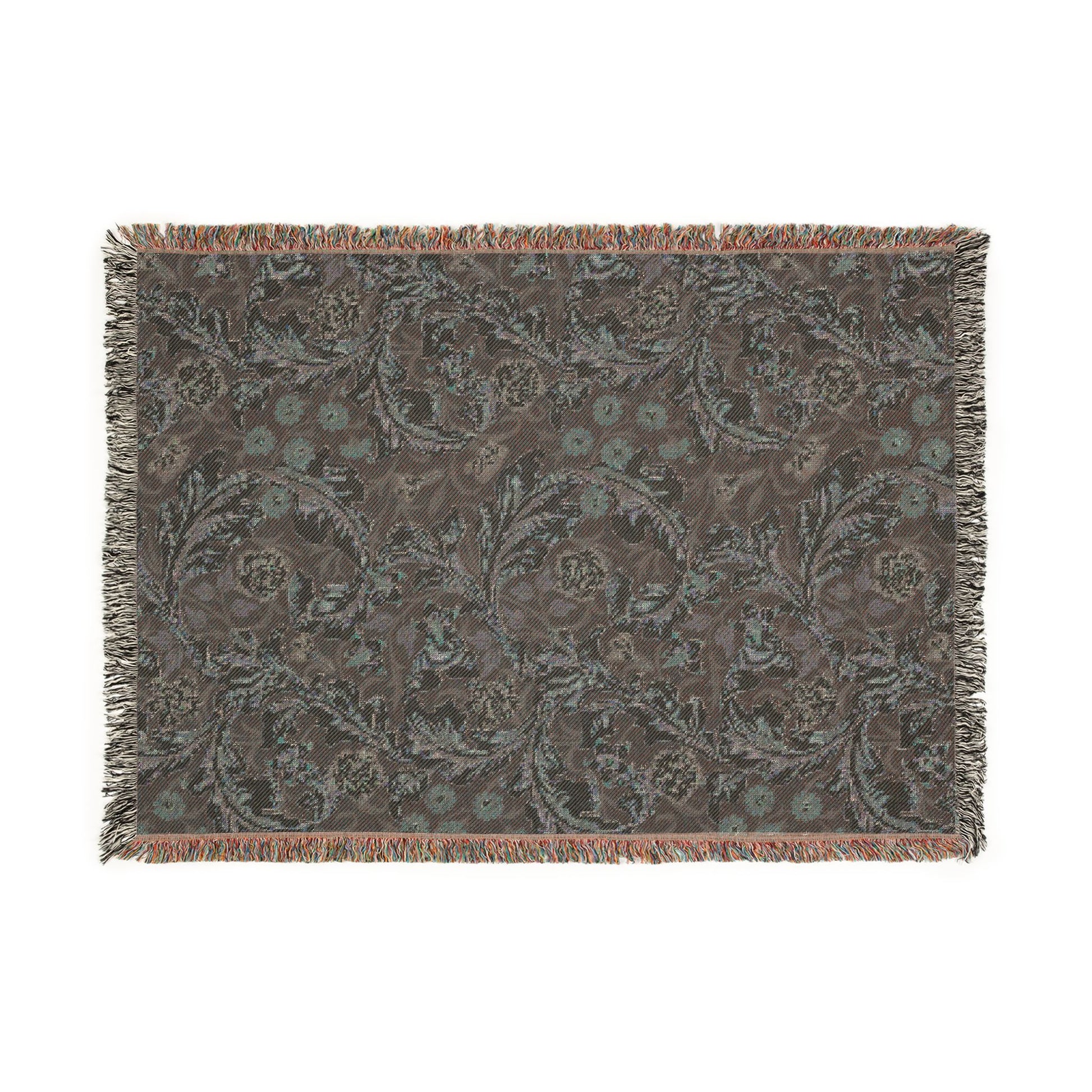 Patterned throw blanket with fringe on a white background