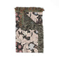 Floral patterned throw blanket with fringes on a white background