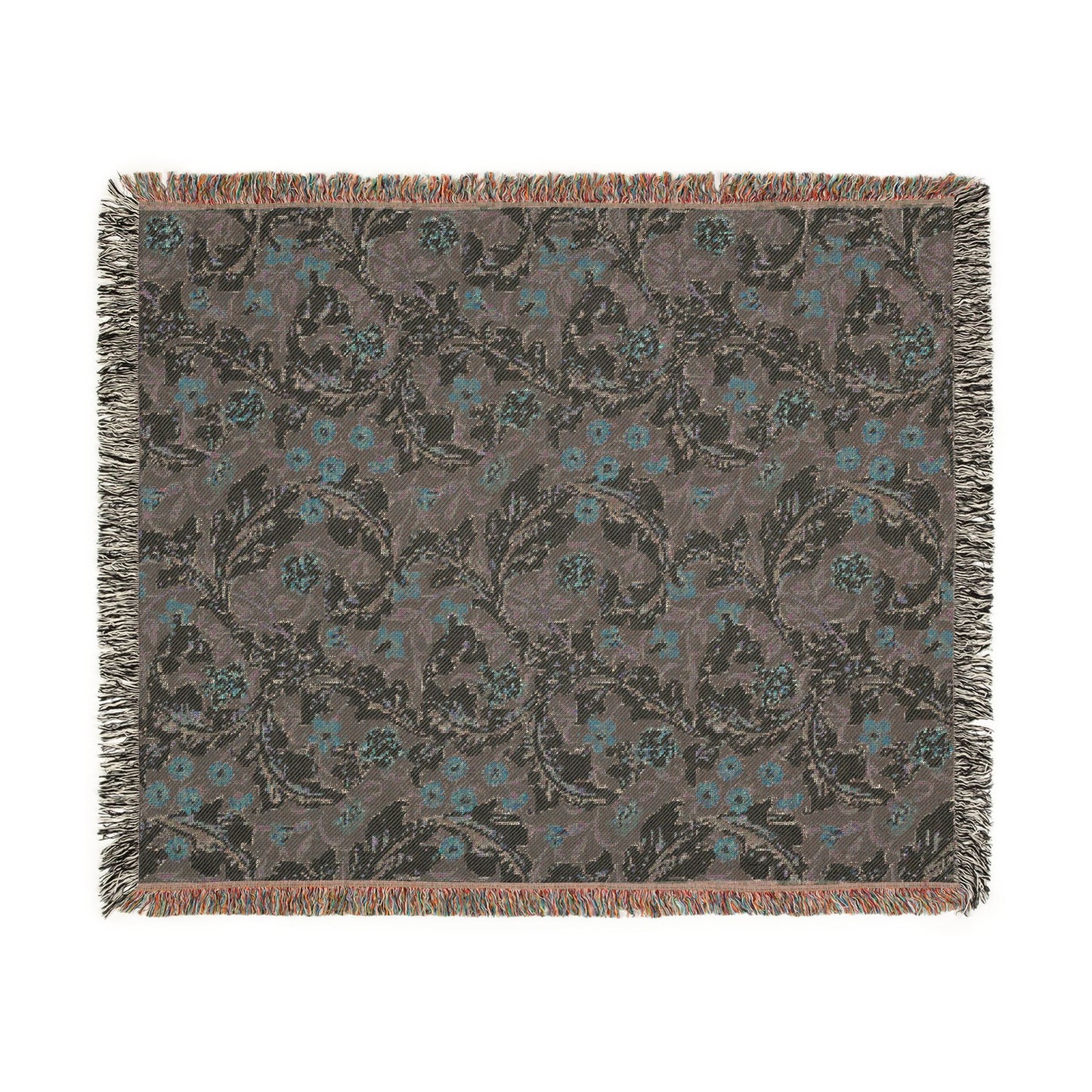 Floral patterned throw blanket with fringe on a white background