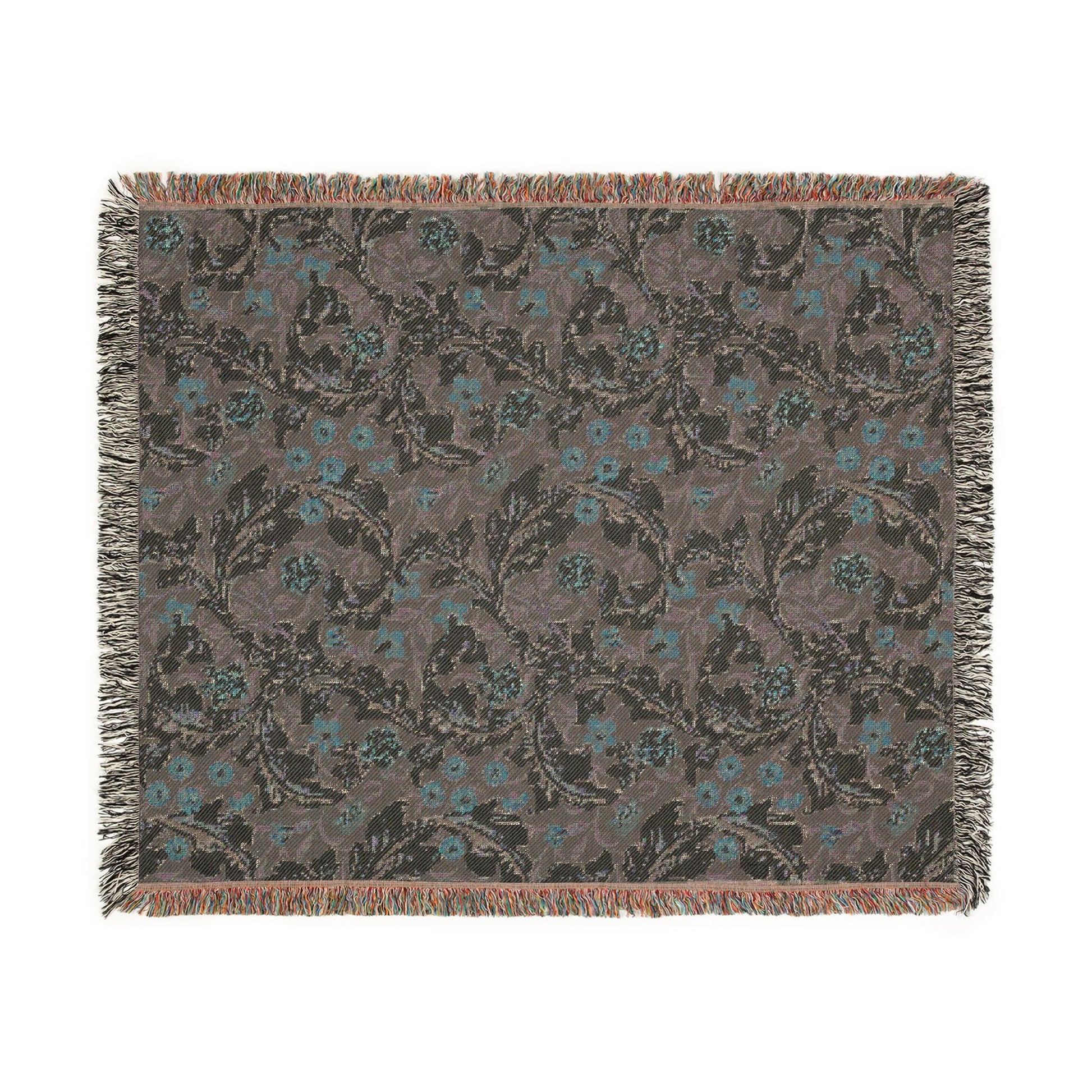 Floral patterned throw blanket with fringe on a white background