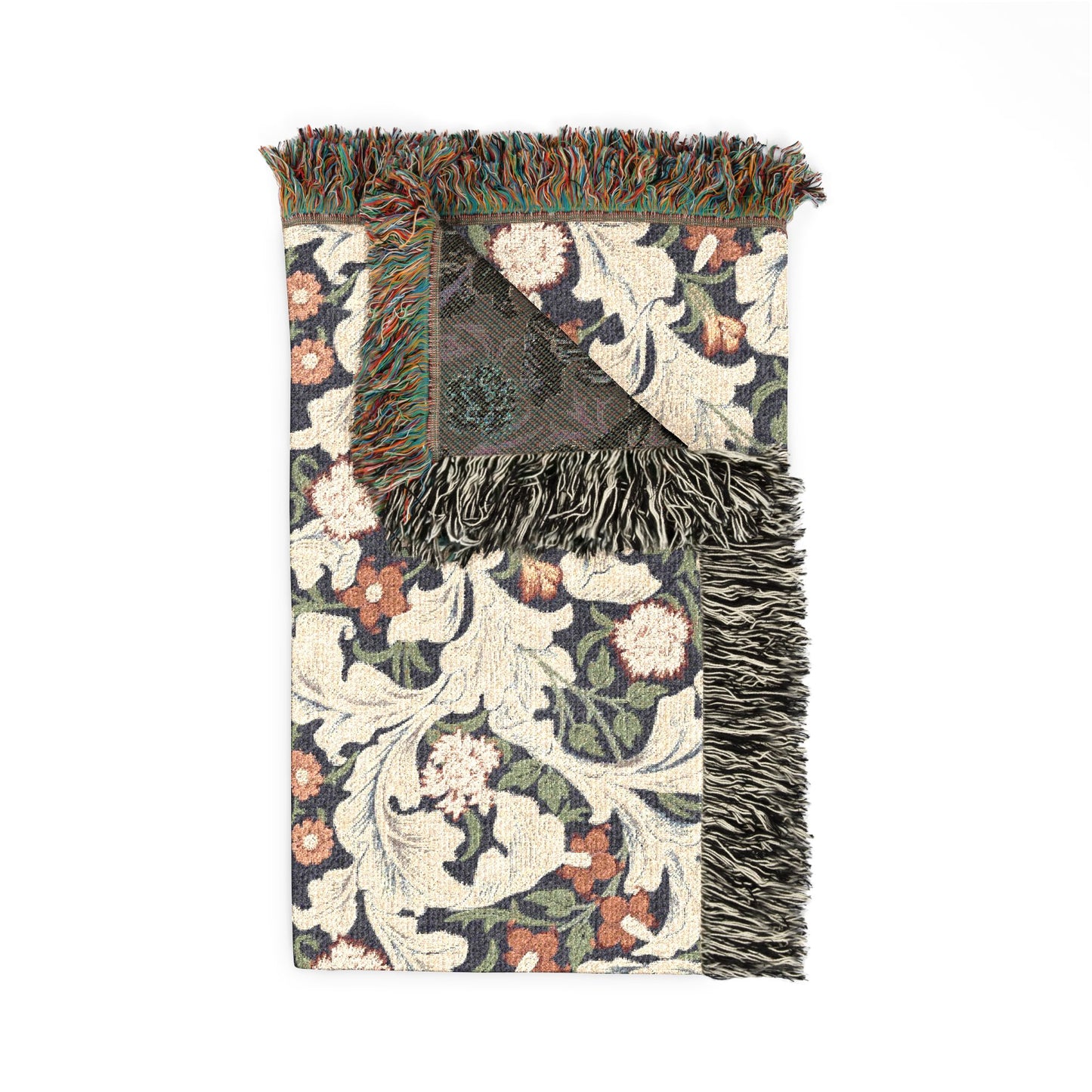 Floral patterned throw blanket with fringed edges on a white background
