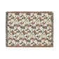 Floral patterned throw blanket with fringe on a white background