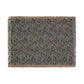 Floral patterned throw blanket with fringe on a white background