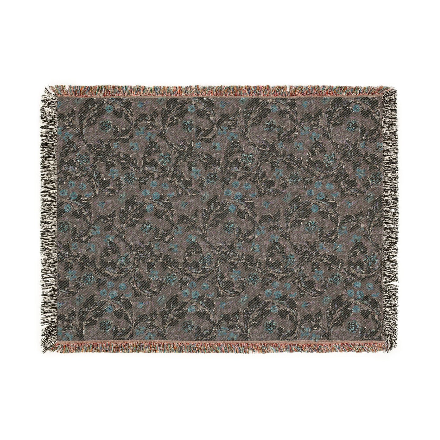 Floral patterned throw blanket with fringe on a white background