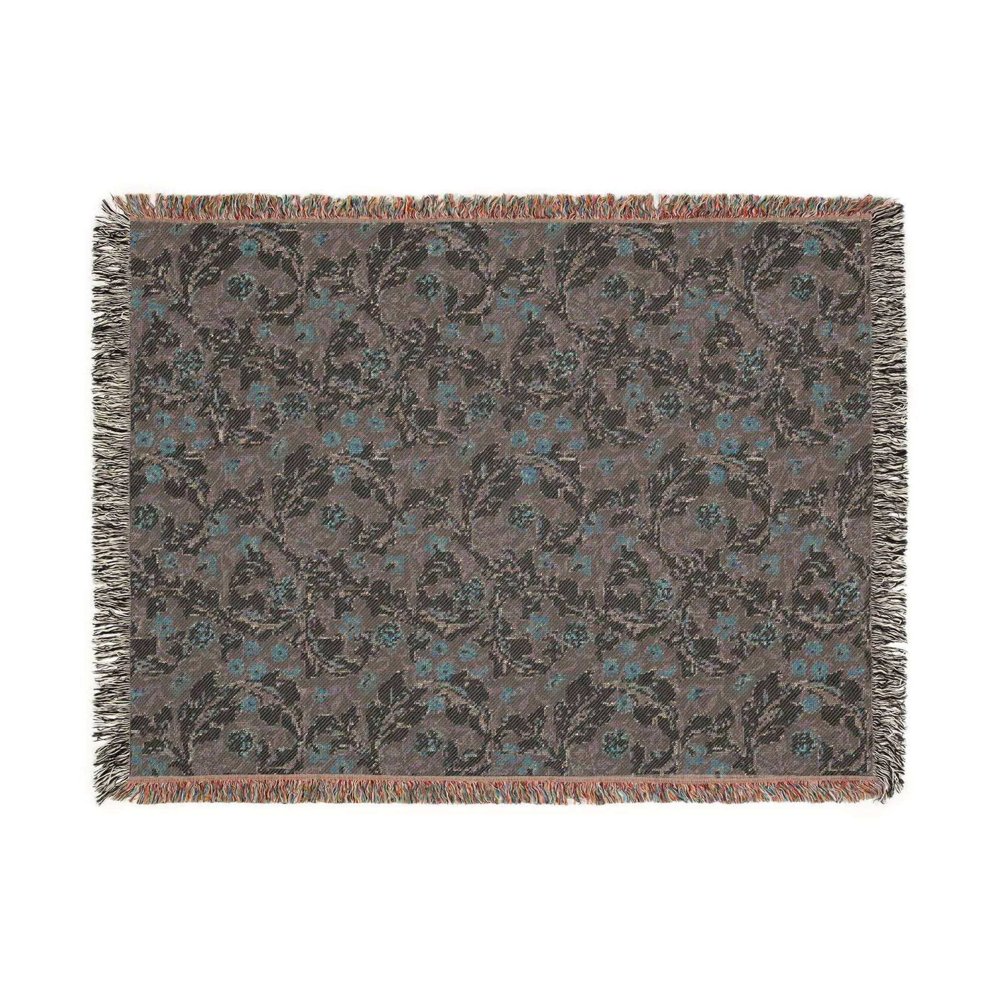 Floral patterned throw blanket with fringe on a white background