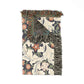 Floral patterned throw blanket with fringes on a white background