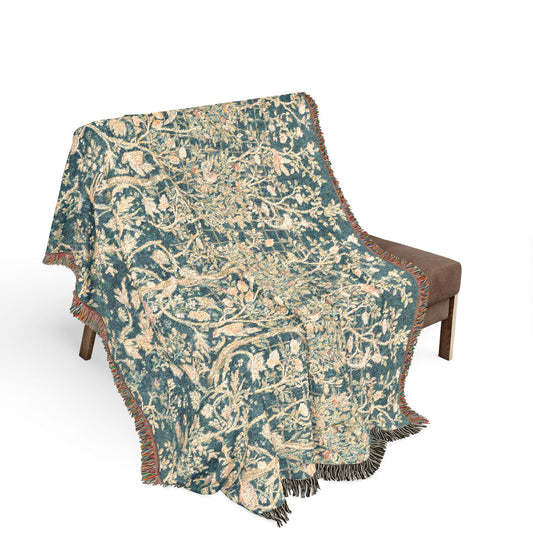 Patterned throw blanket draped over a chair on a white background