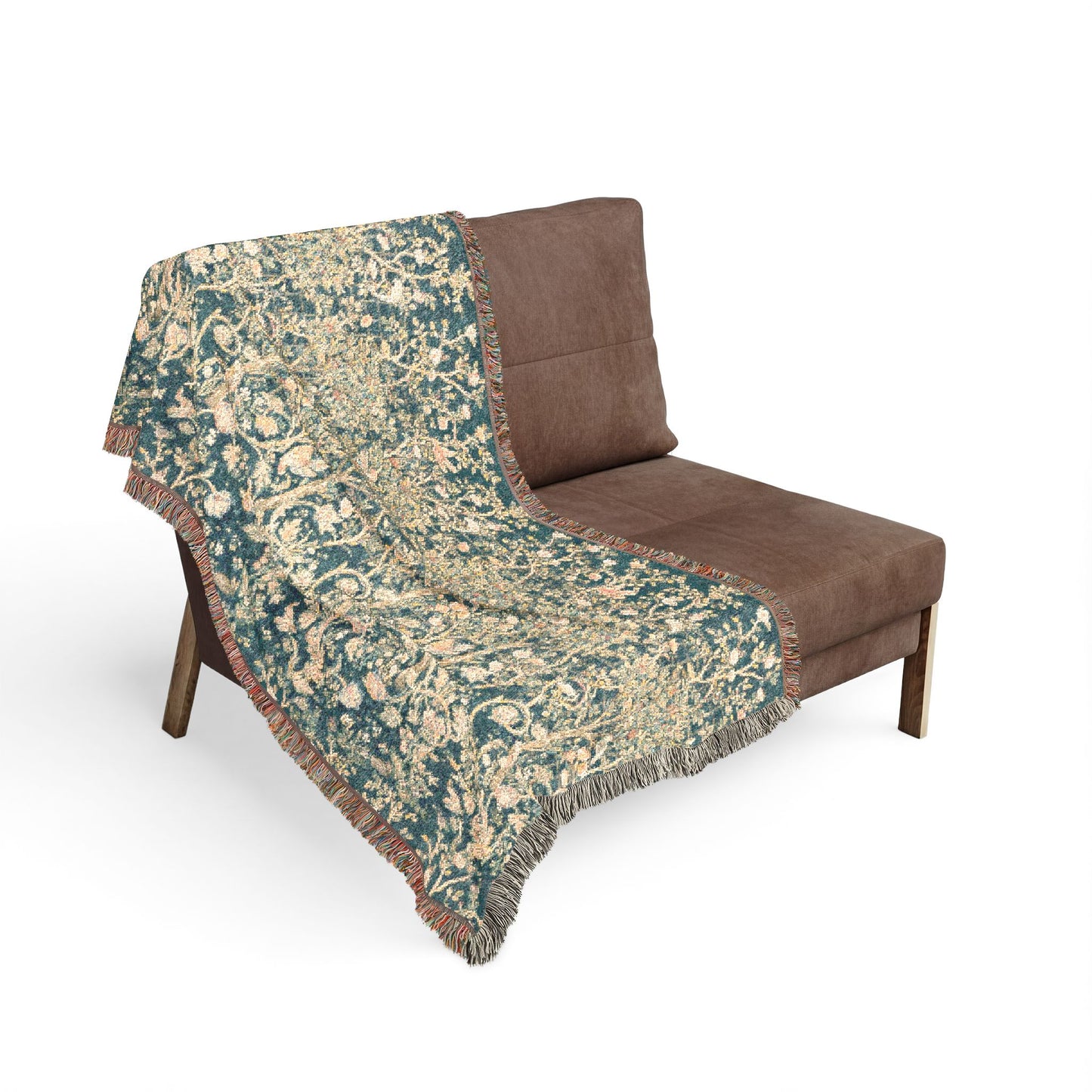 Floral-patterned throw blanket draped over a brown chair on a white background