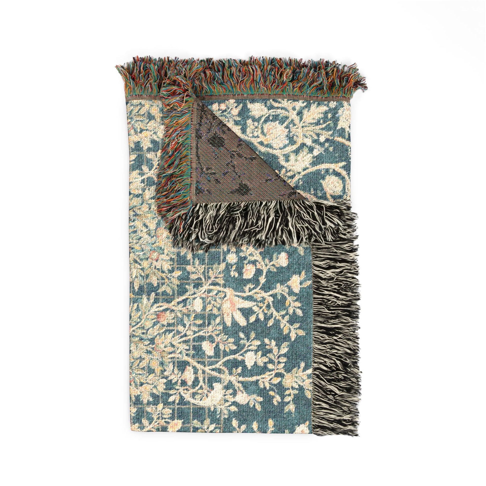Decorative rug with floral pattern and fringed edge on a white background