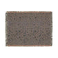 Textured throw blanket with a pattern on a white background