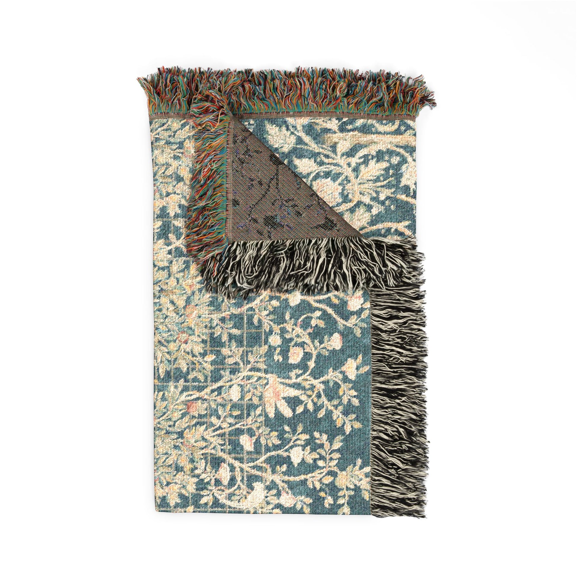 Decorative rug with floral pattern and fringed edge on a white background
