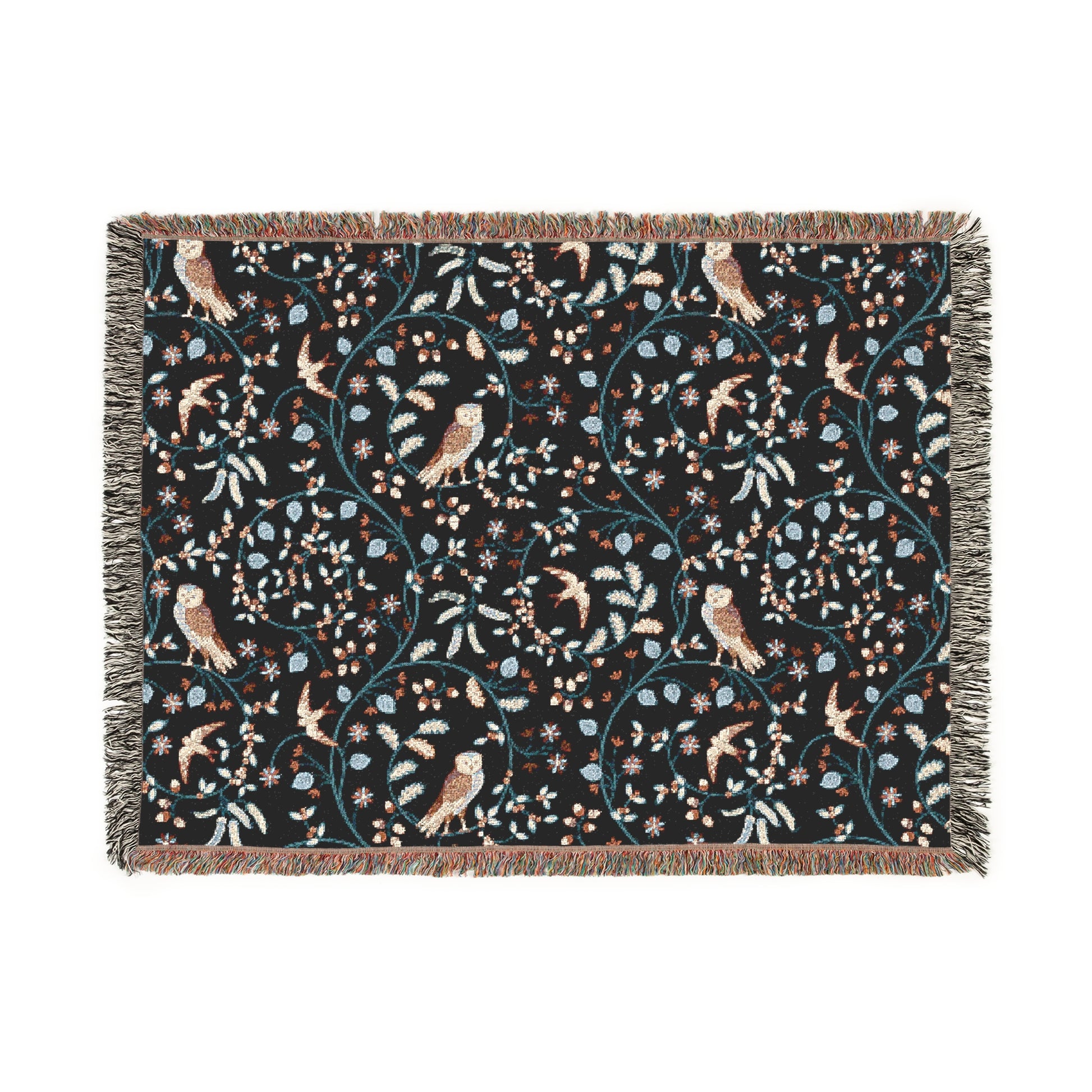Decorative throw blanket with bird and floral pattern on a black background