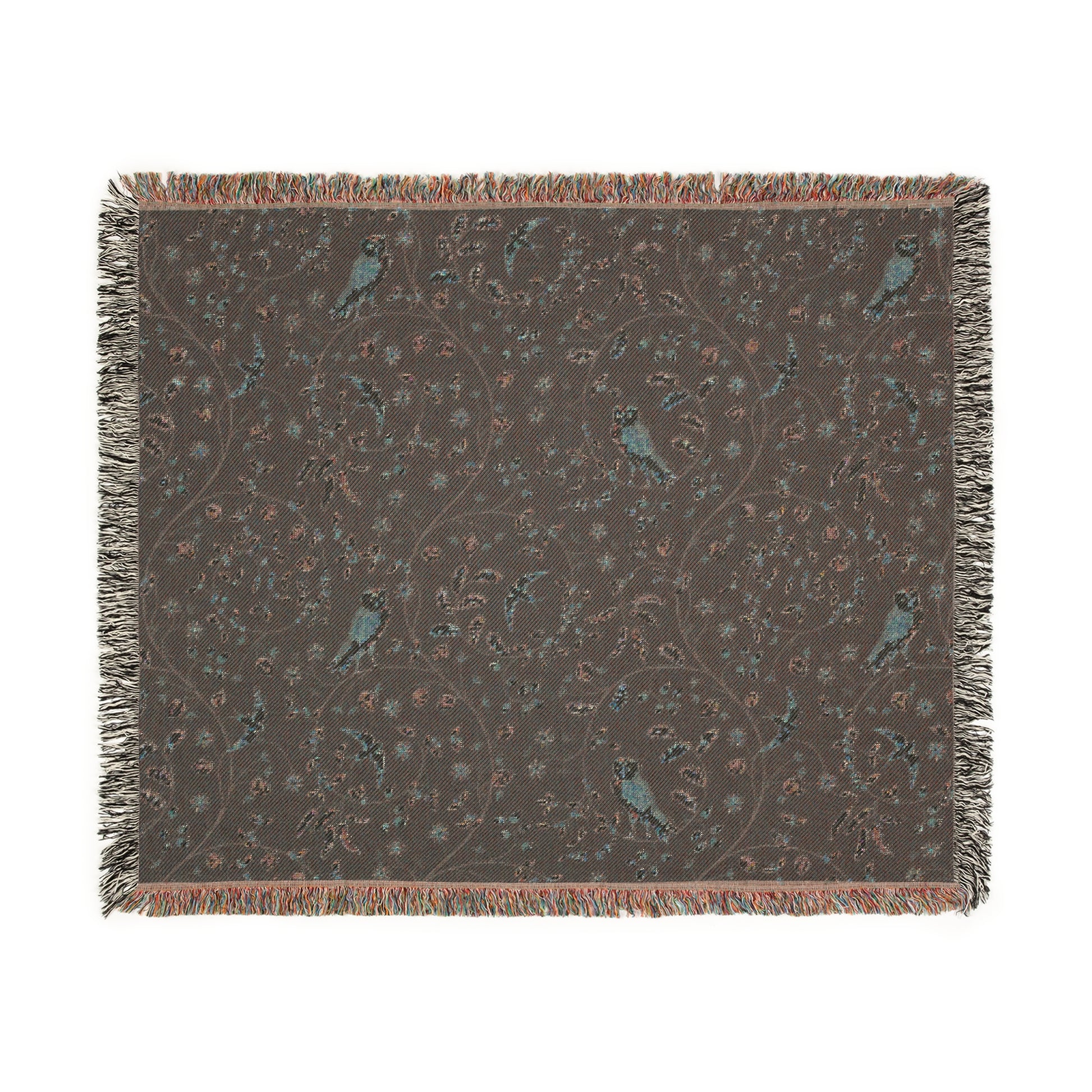 Decorative throw blanket with bird pattern on a plain background