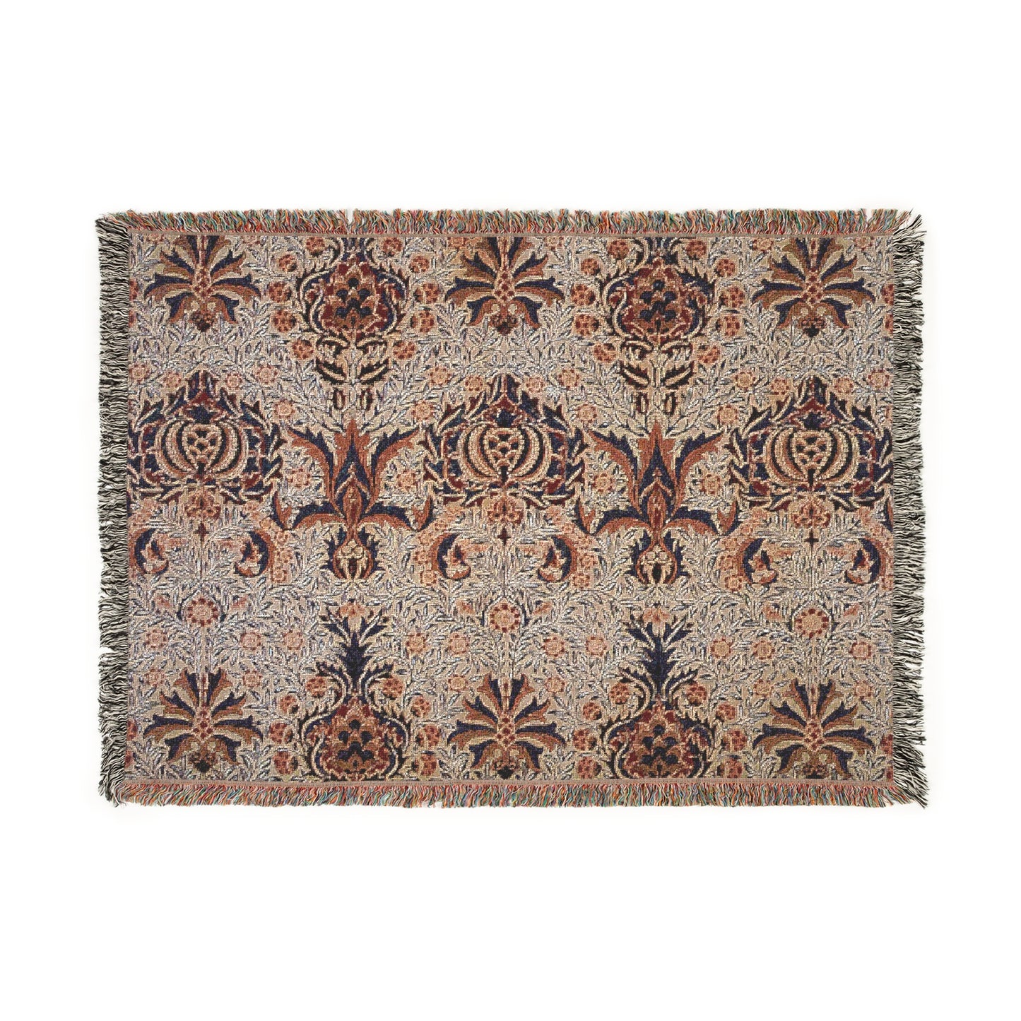 A woven cotton blanket with a geometric William Morris & Co pattern in shades of brown, beige, and black, with a colourful fringed edge.