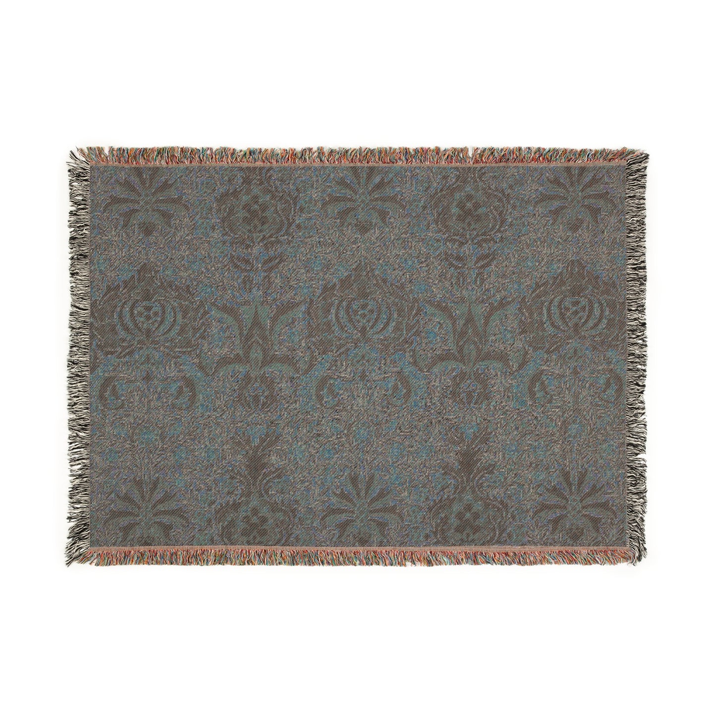 A woven cotton blanket with a geometric William Morris & Co pattern in shades of brown, beige, and black, with a colourful fringed edge.