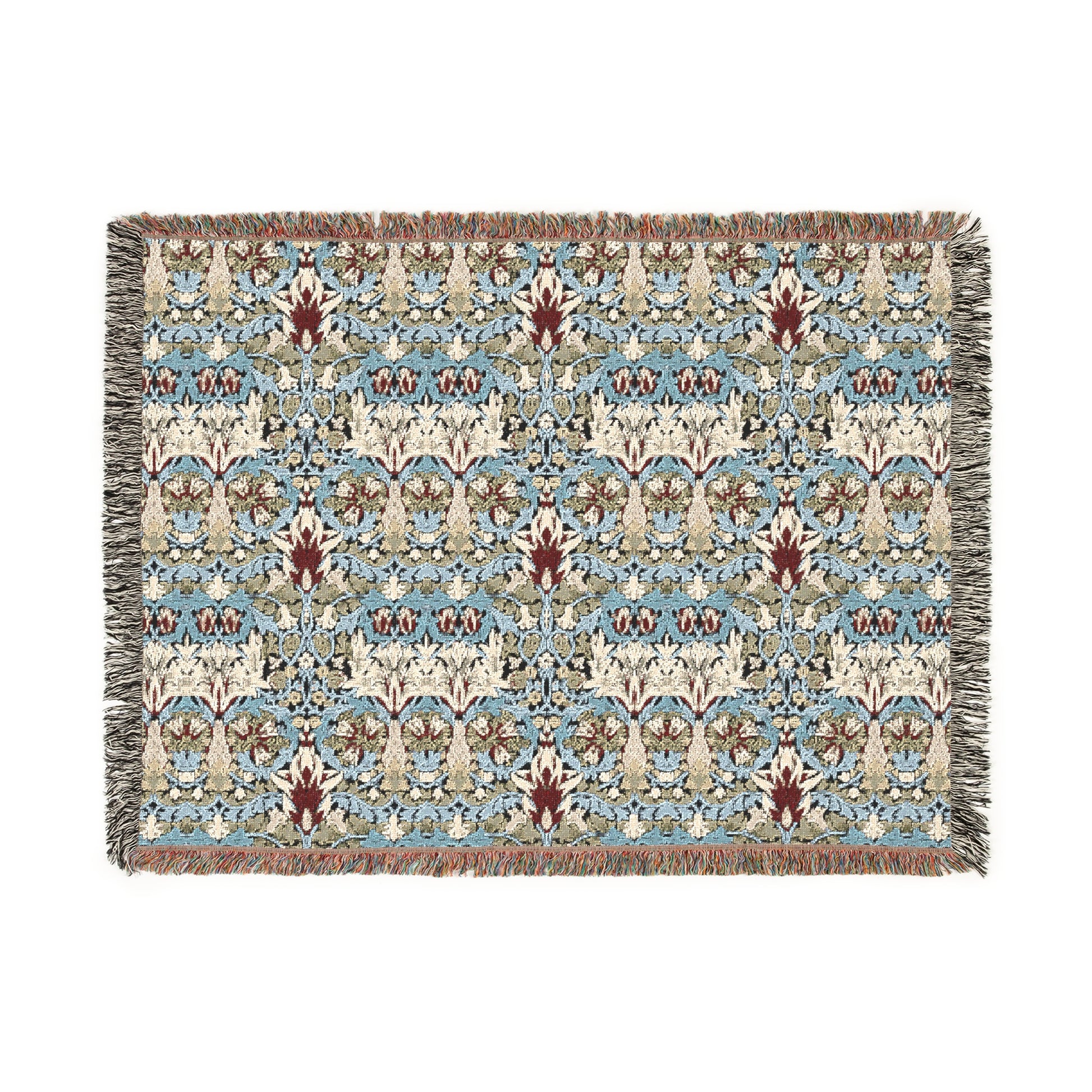 A woven blanket with a floral pattern in shades of blue, beige, and red with a fringed edge.