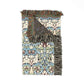 Decorative throw blanket with intricate pattern and fringes on a white background