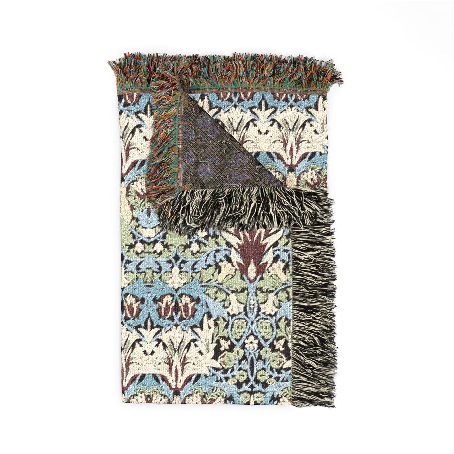 Patterned throw blanket with fringes on a white background