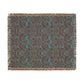 Patterned throw blanket with fringe on a white background