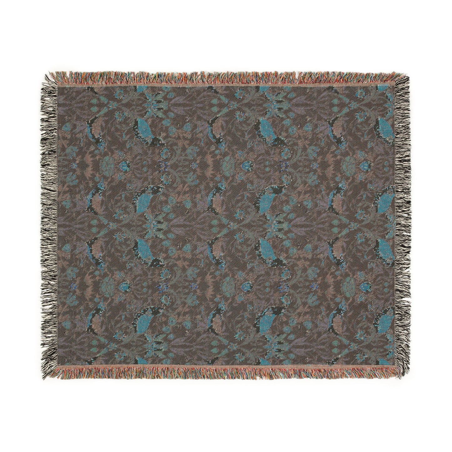 Patterned throw blanket with fringe on a white background