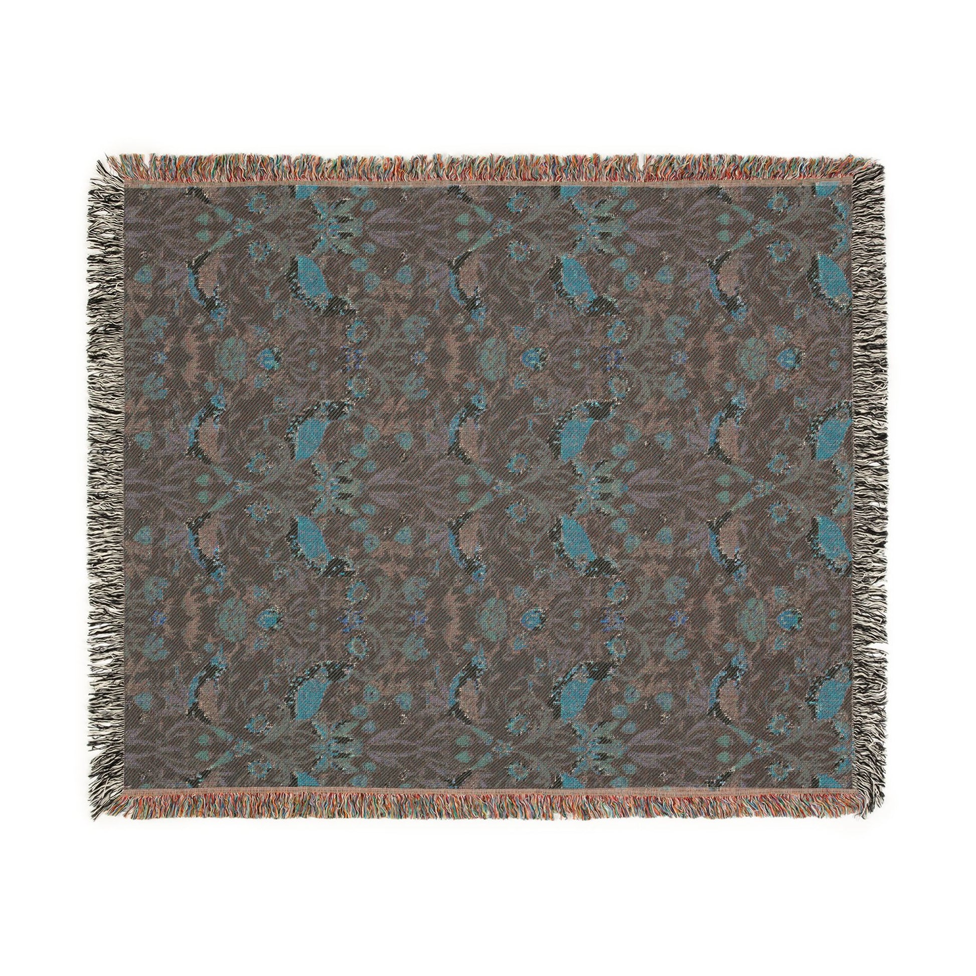Patterned throw blanket with fringe on a white background