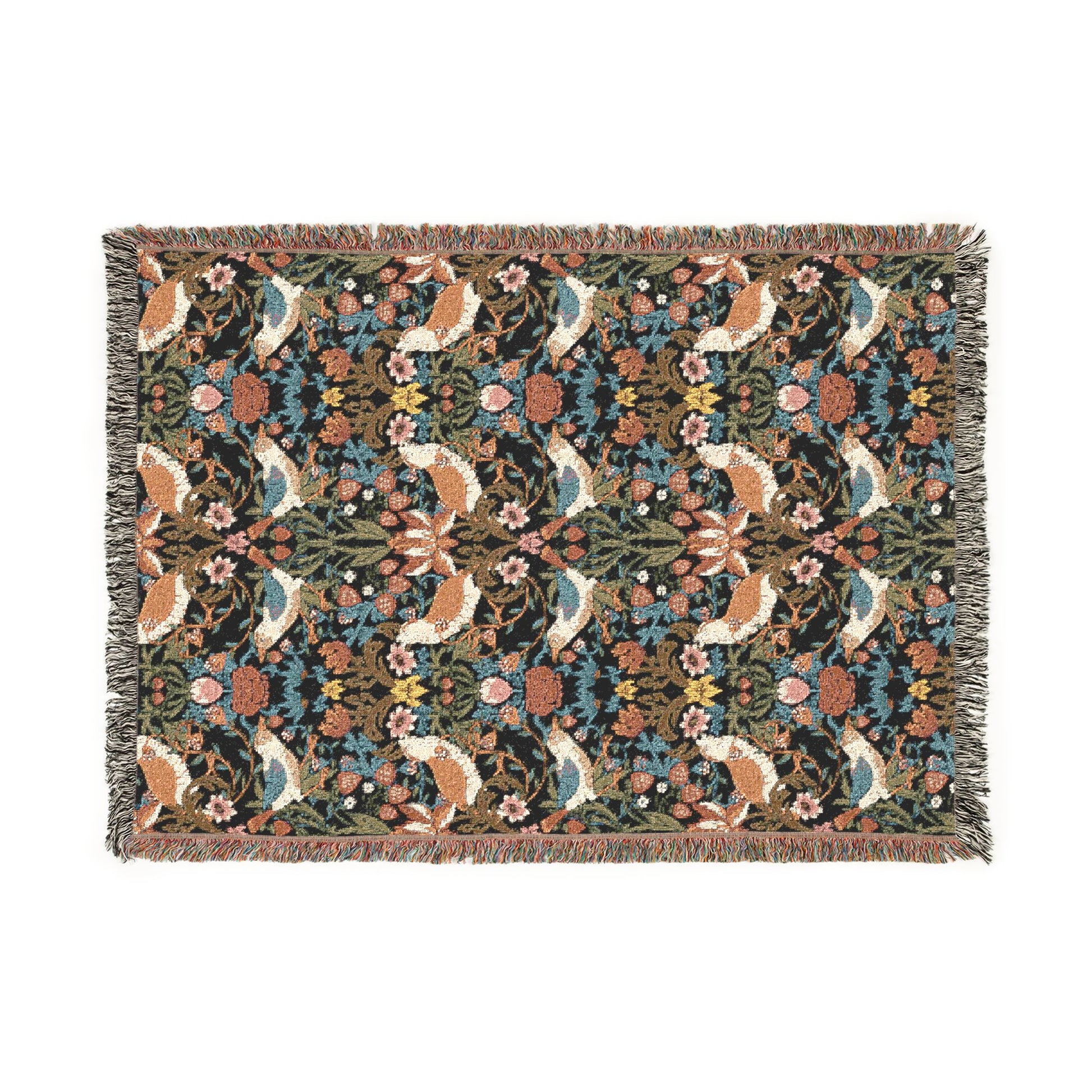 Floral and animal patterned throw blanket on a white background