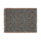 Patterned throw blanket with fringe on a white background