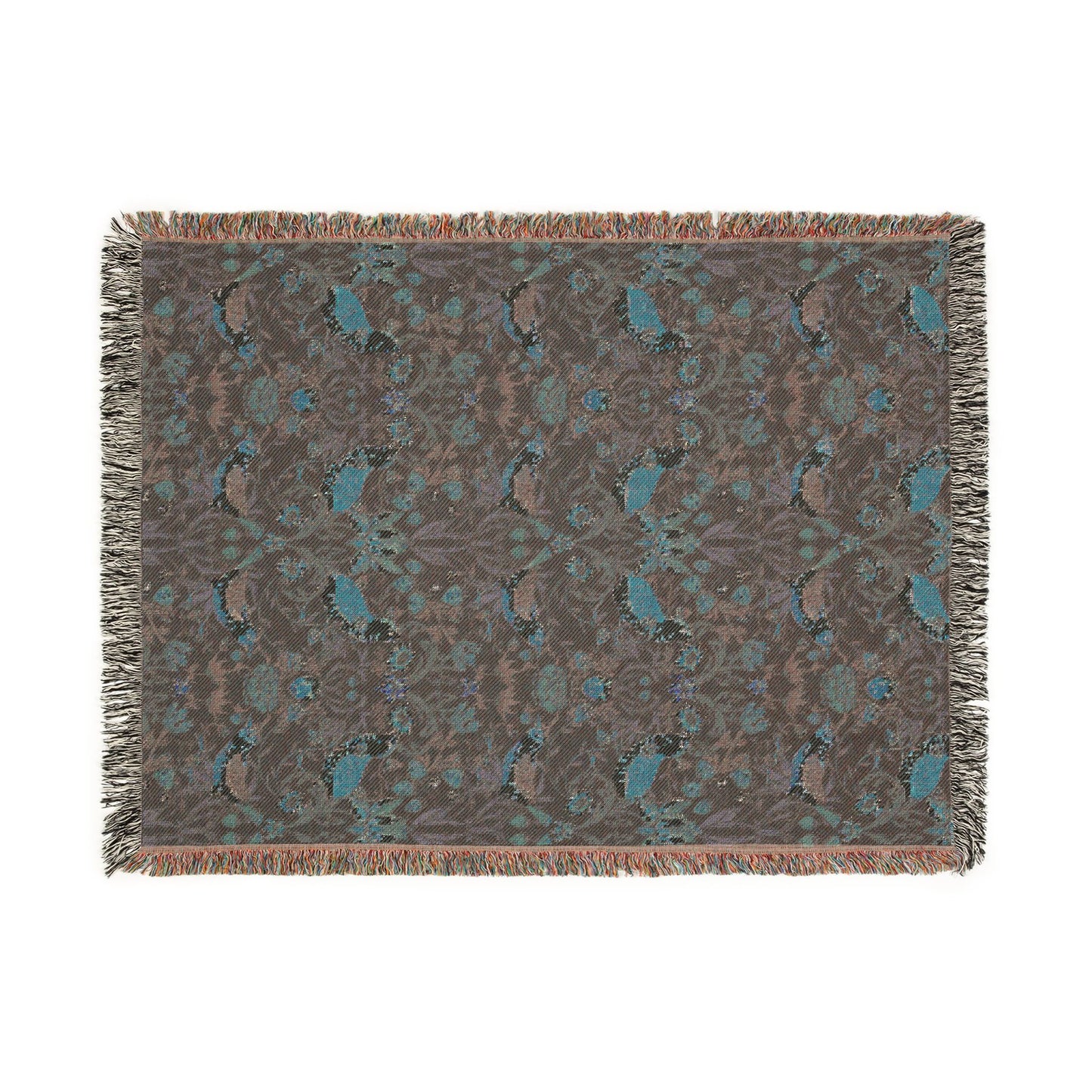 Patterned throw blanket with fringe on a white background