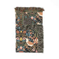 Decorative throw blanket with floral and bird pattern on a white background