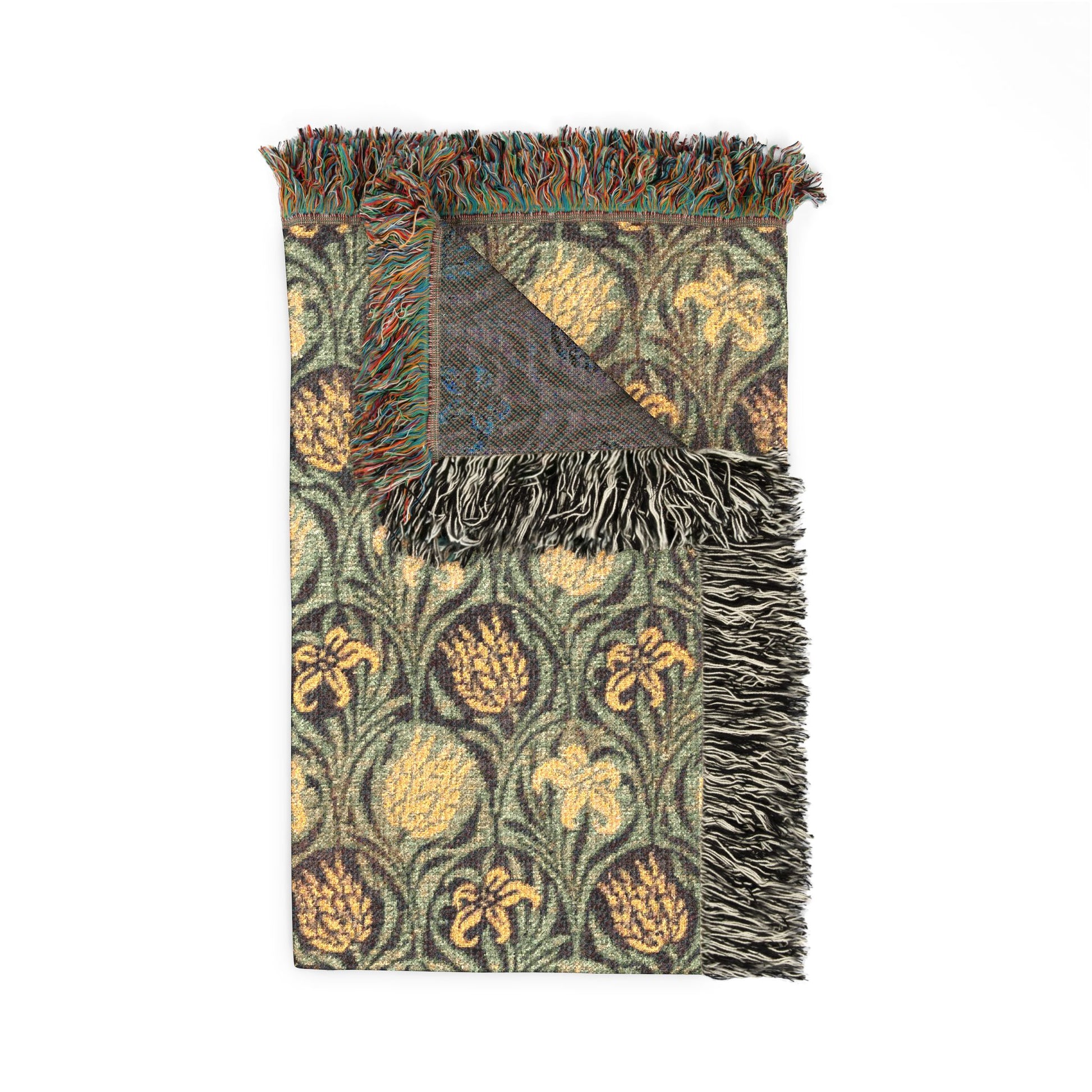 Decorative throw blanket with floral pattern and fringed edges on a white background