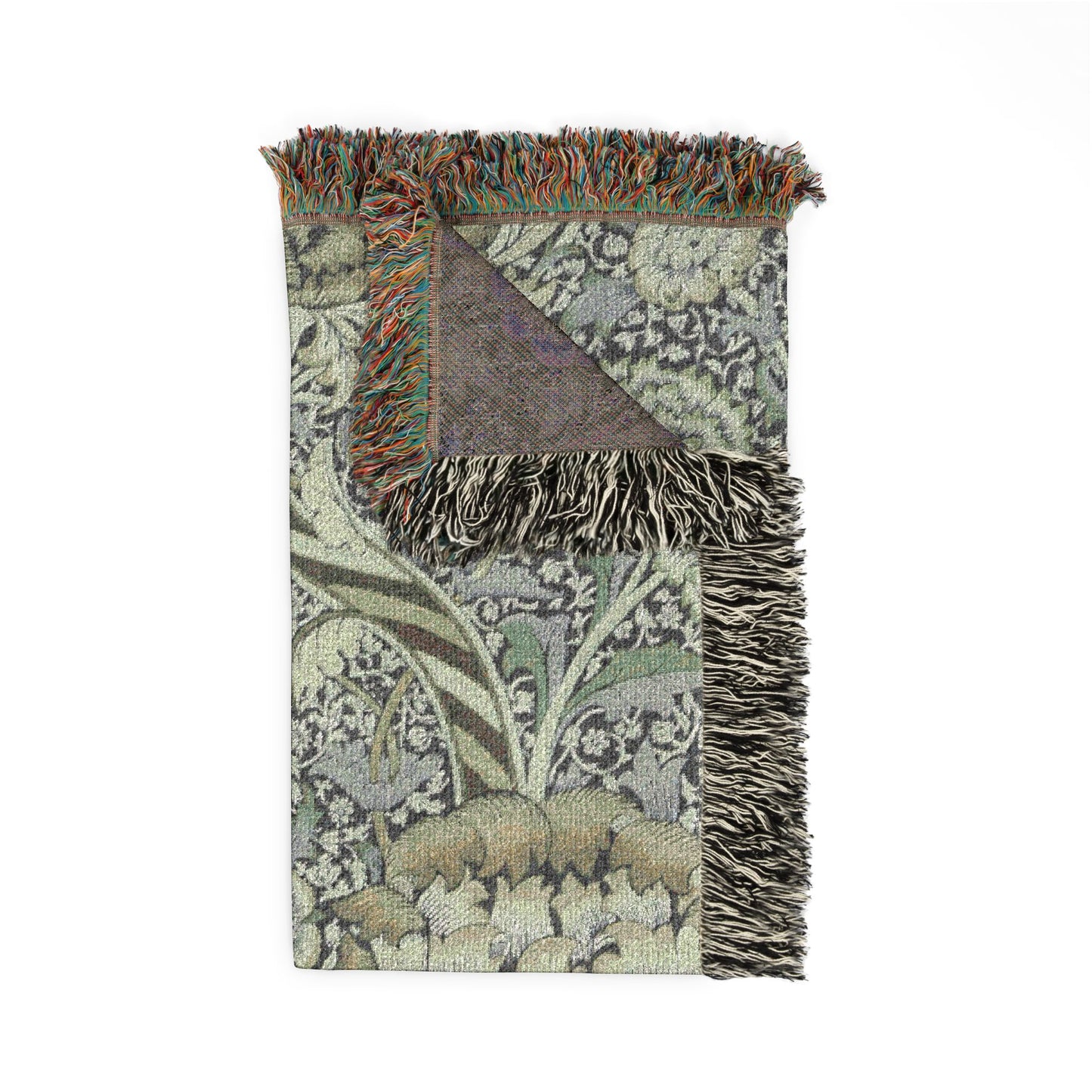 Decorative throw blanket with floral pattern and fringes on a white background