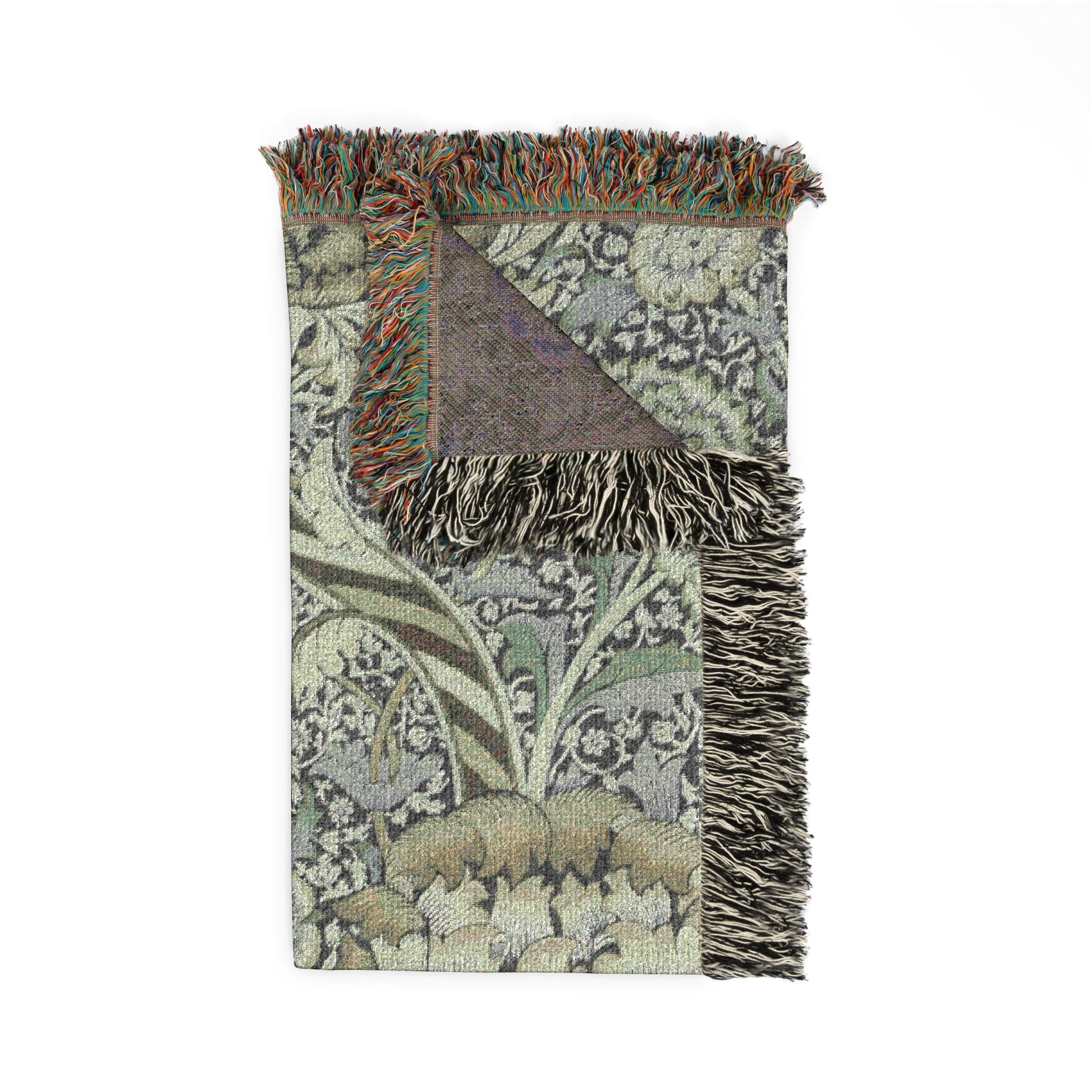 Decorative throw blanket with floral pattern and fringes on a white background