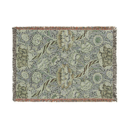 Floral patterned throw blanket with fringe on a white background