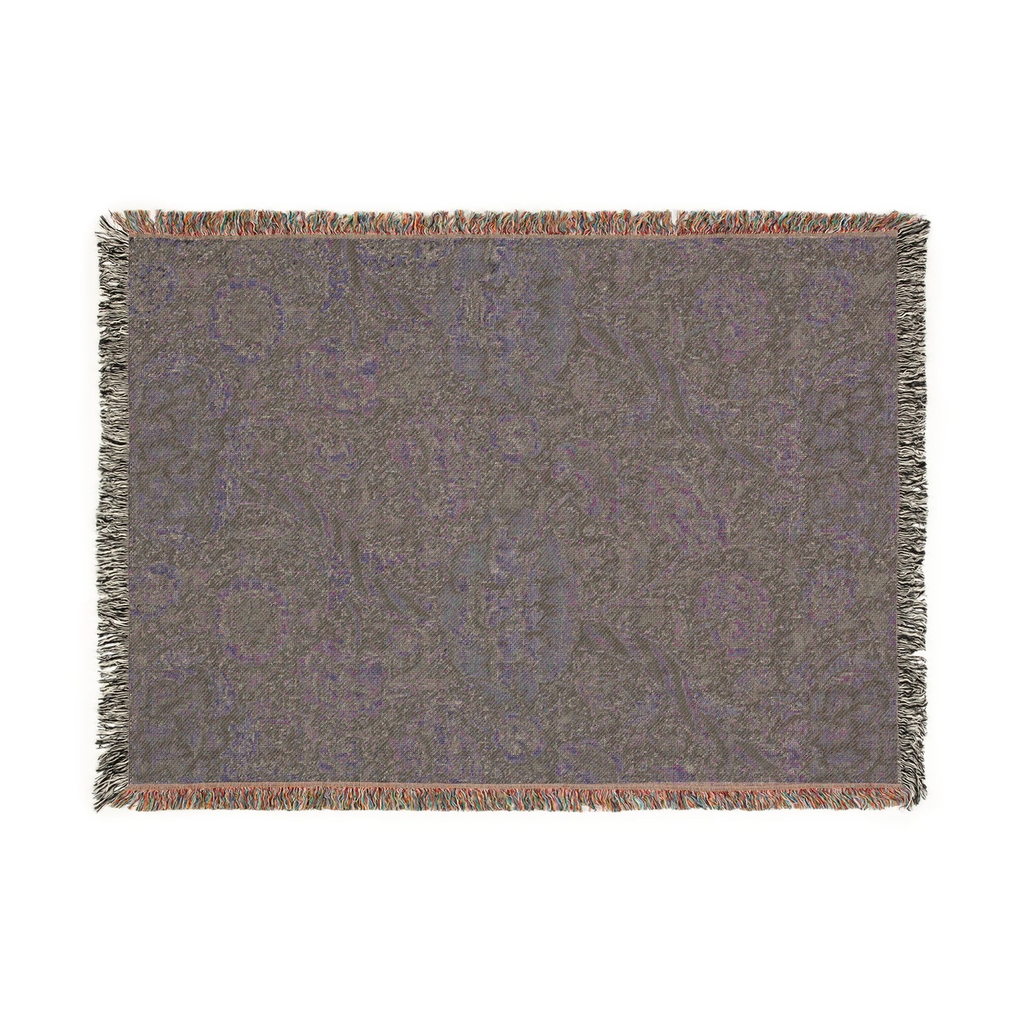 A woven cotton blanket with a geometric William Morris & Co pattern in shades of gray and a colourful fringe along the edges.