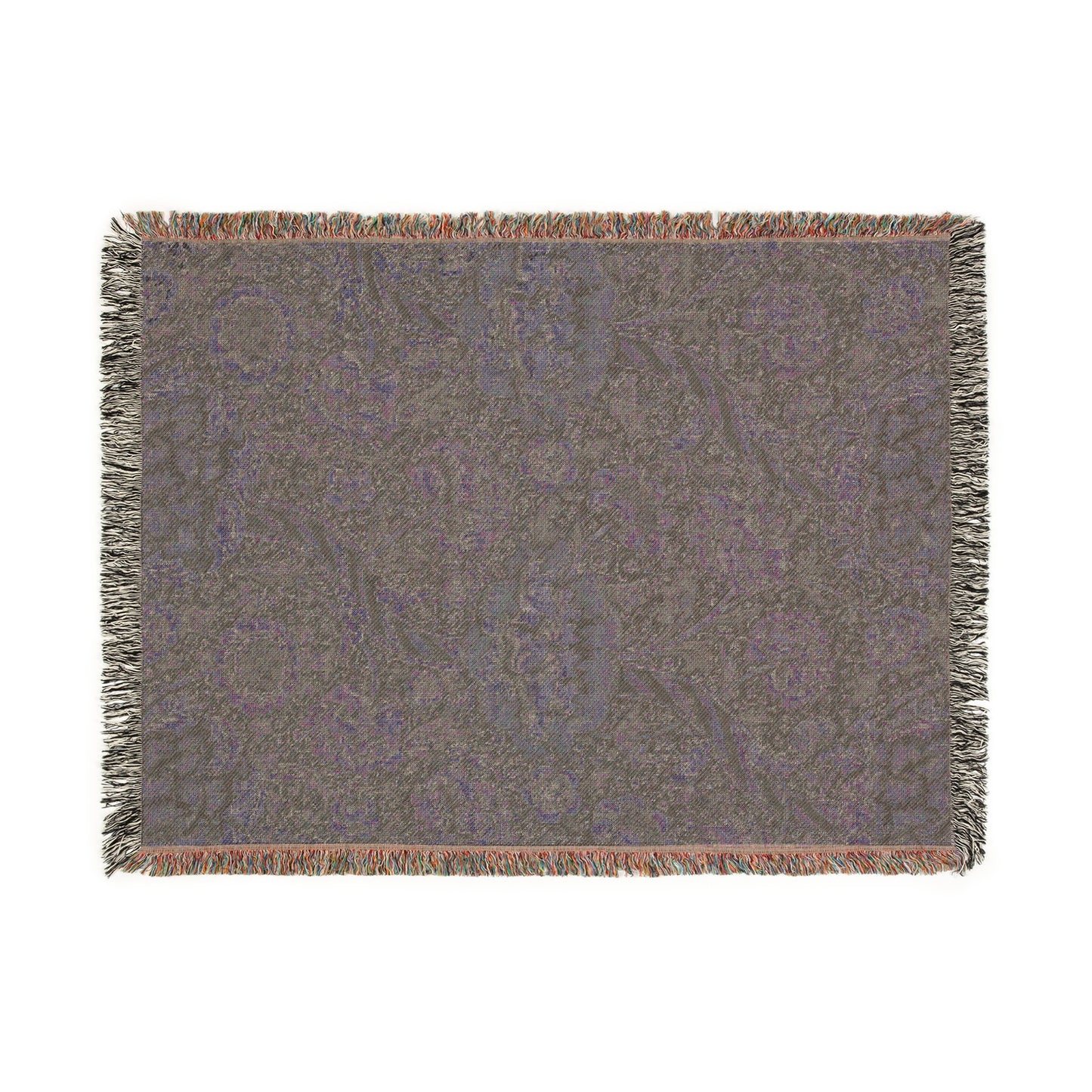 A woven cotton blanket with a geometric William Morris & Co pattern in shades of gray and a colourful fringe along the edges.