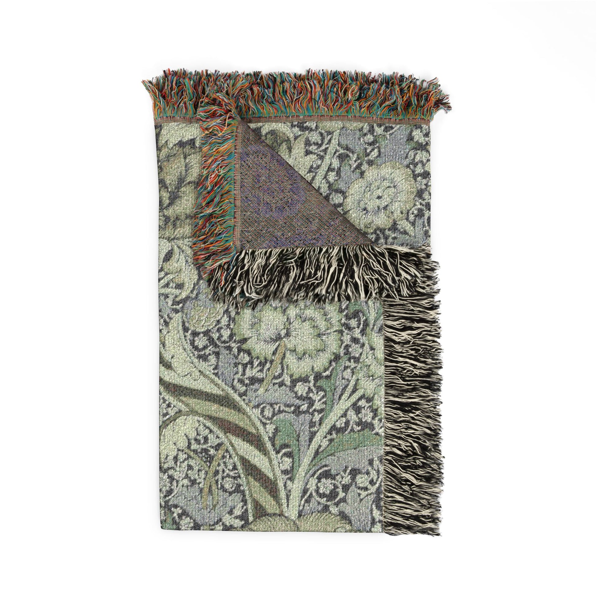 Patterned throw blanket with fringes on a white background
