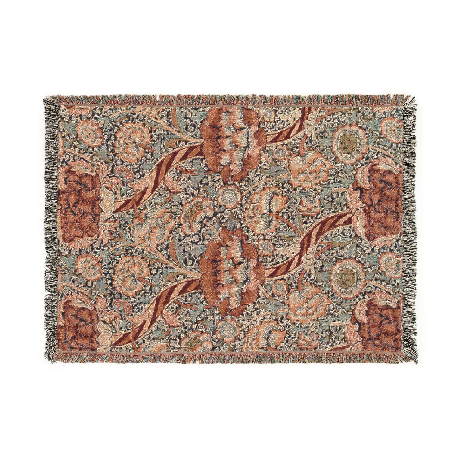 A woven cotton blanket with a geometric and floral William Morris & Co pattern in red, blue, beige, and brown colours, with fringed edges.