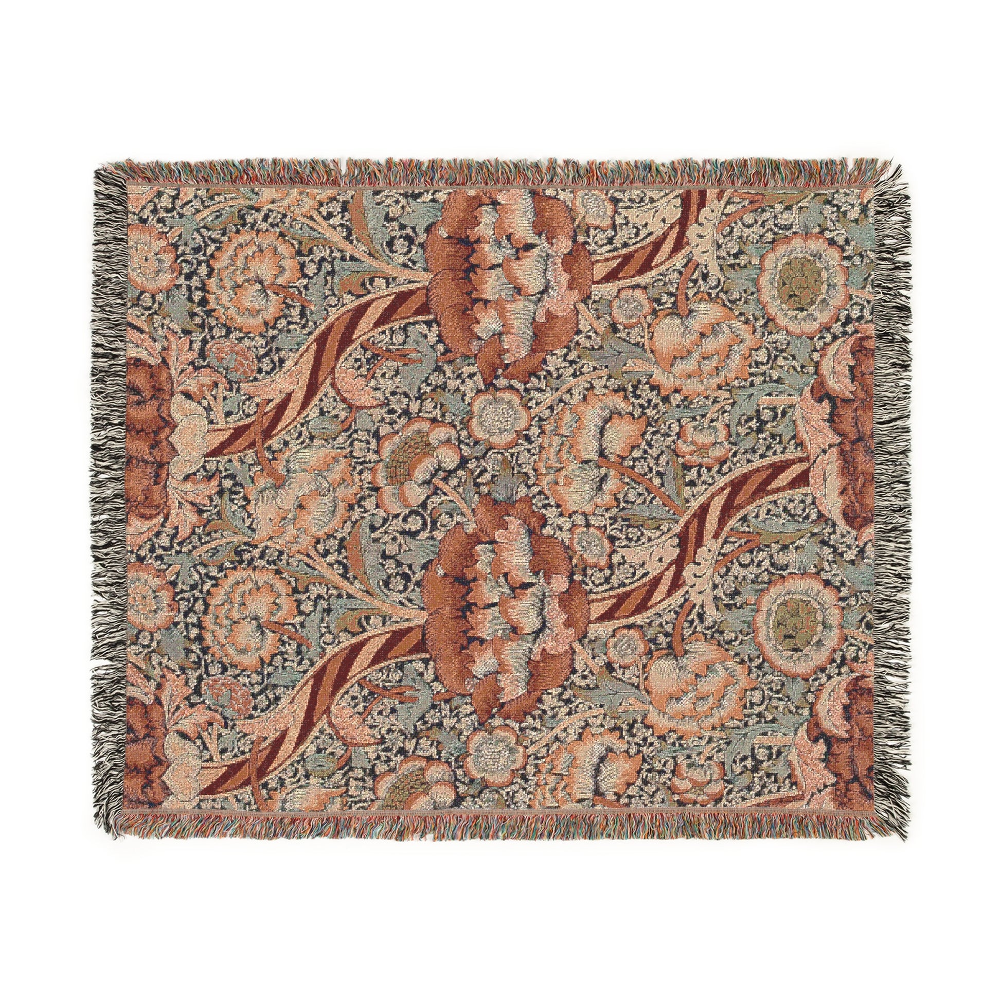 A woven cotton blanket with a geometric and floral William Morris & Co pattern in red, blue, beige, and brown colours, with fringed edges.