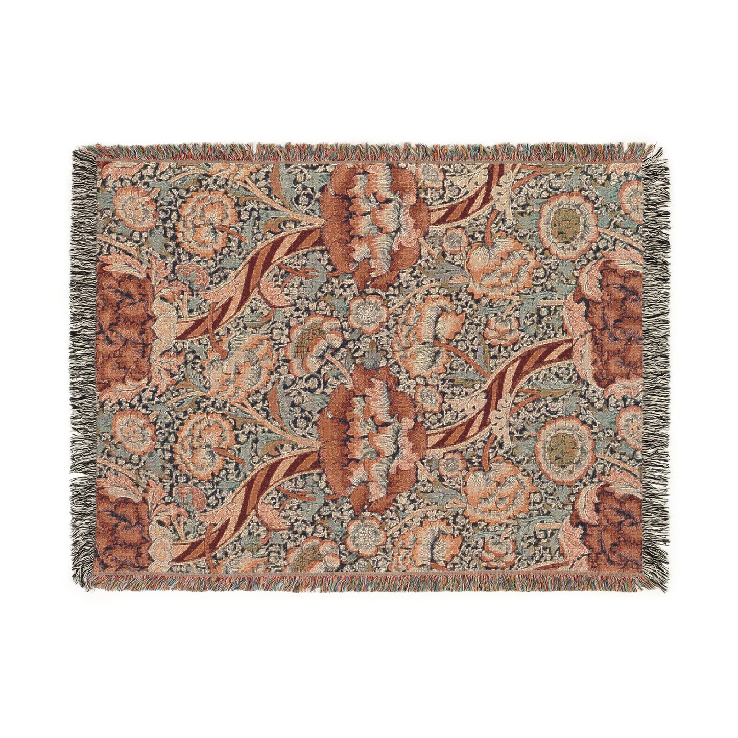 A woven cotton blanket with a geometric and floral William Morris & Co pattern in red, blue, beige, and brown colours, with fringed edges.