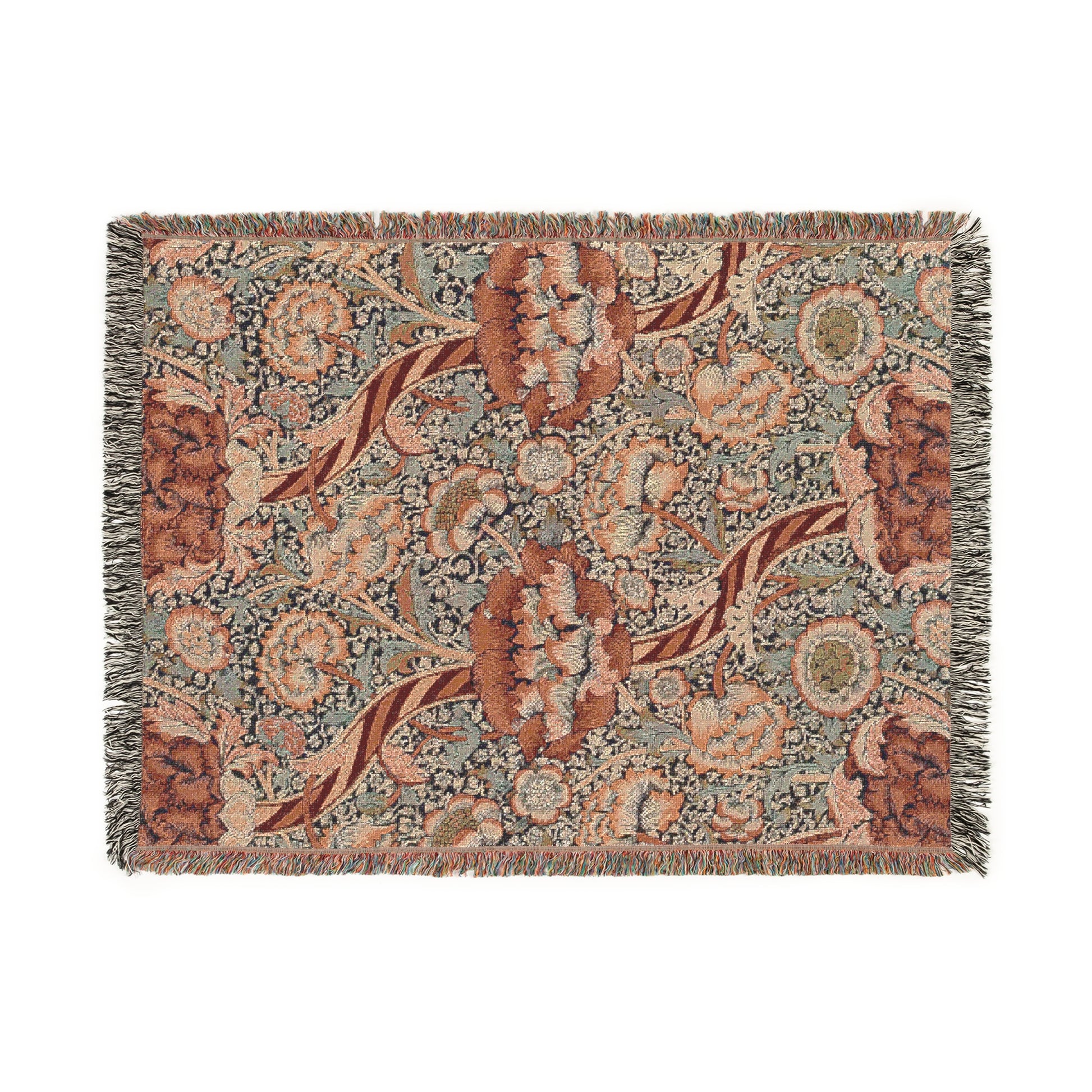 A woven cotton blanket with a geometric and floral William Morris & Co pattern in red, blue, beige, and brown colours, with fringed edges.