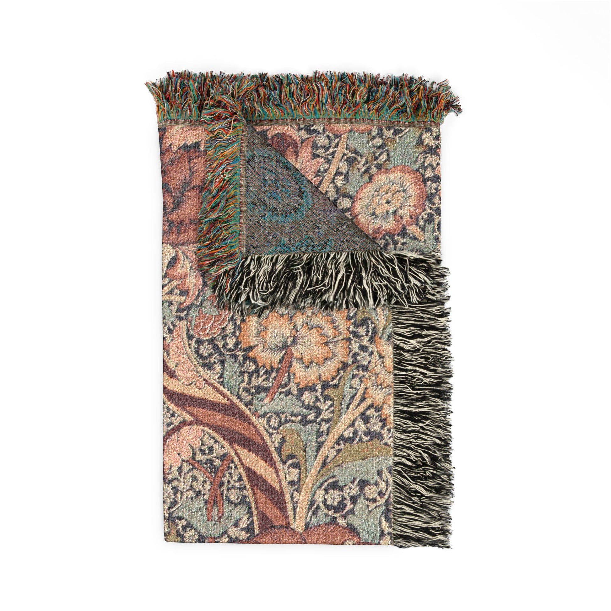 Decorative throw blanket with intricate patterns and fringes on a white background