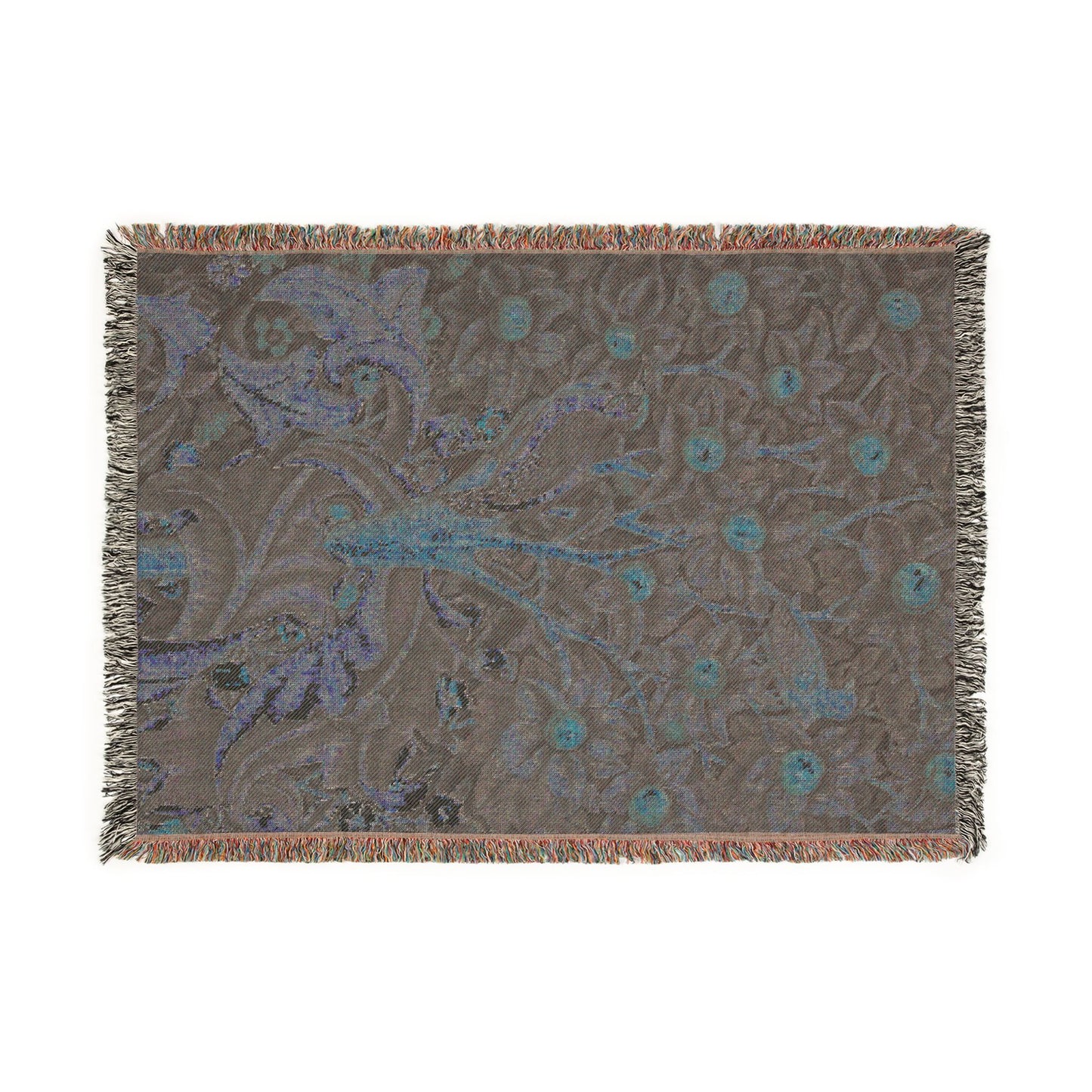 Decorative throw blanket with floral pattern on a plain background