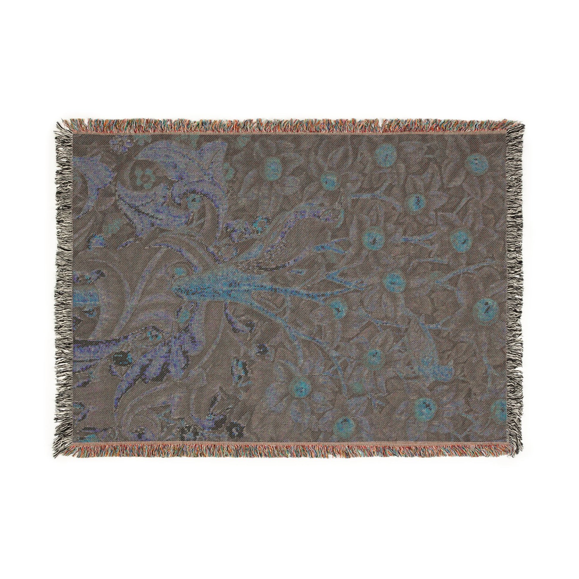 Decorative throw blanket with floral pattern on a plain background