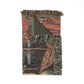 Woven blanket with fringes featuring a cabin design on a white background